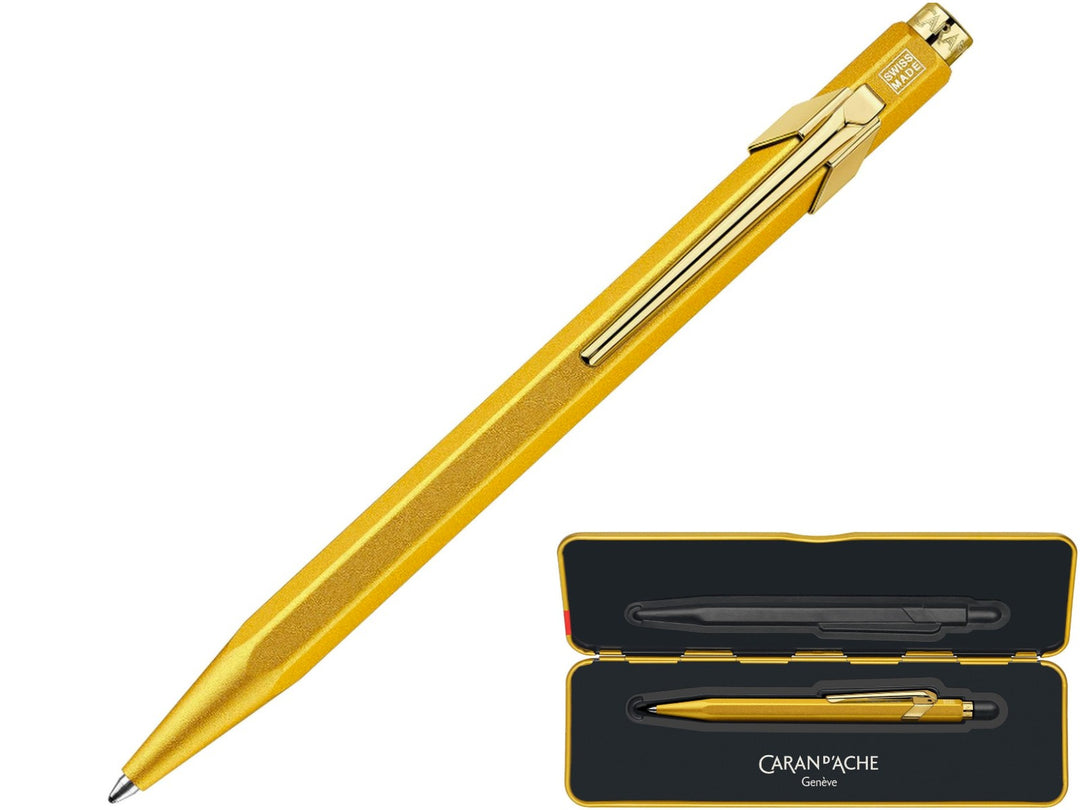 Caran d'Ache 849 goldbar ballpoint pen with metal tin