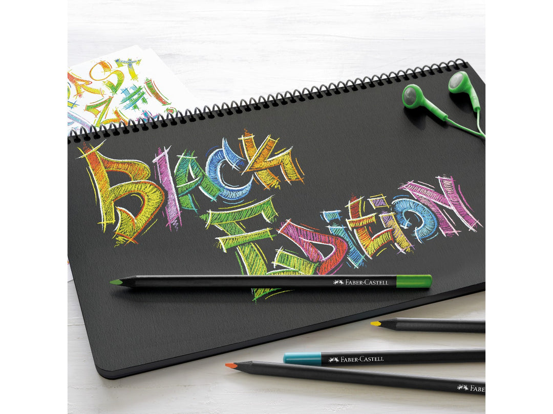 Faber-Castell Black Edition Colour Pencils being used to create vibrant artwork on black paper, demonstrating the super-soft colour leads, rich pigmentation and ability to produce bright, opaque colours on dark surfaces.
