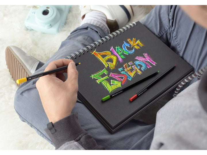 Faber-Castell Black Edition Colour Pencils being used to create colourful artwork on black paper, demonstrating the super-soft leads, rich pigments and vibrant colour laydown that stand out on dark, coloured and light paper surfaces.