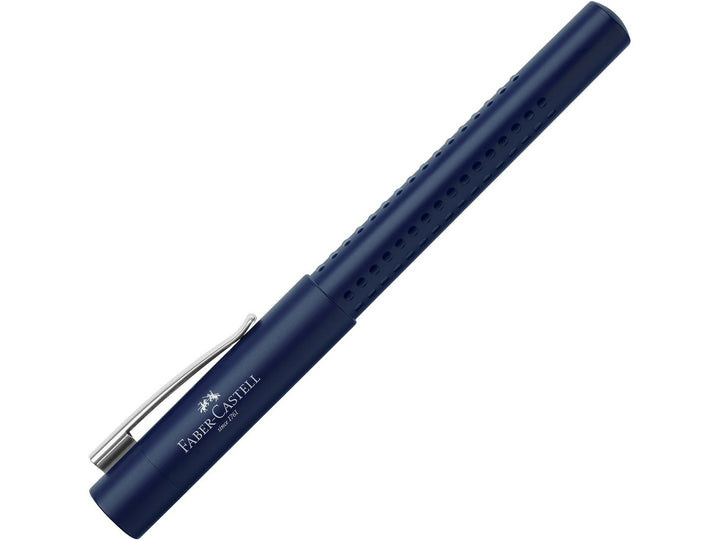 Faber-Castell Grip 2011 Fountain Pen in Classic Blue with cap fitted, featuring an ergonomic triangular barrel with patented Grip dots, durable metal pocket clip and contemporary blue finish for comfortable everyday handwriting, journaling, note-taking and professional writing.
