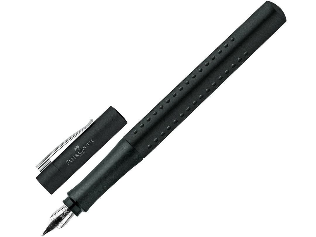 Faber-Castell Grip 2011 Fountain Pen in Black with cap removed, featuring an ergonomic triangular barrel with patented Grip dots, durable stainless steel nib and metal pocket clip, displayed alongside the matching cap for everyday handwriting, journaling, note-taking and professional writing.