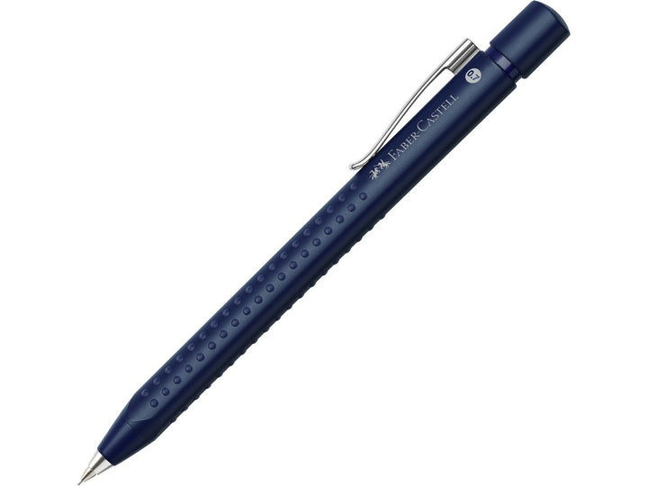 Close-up of the fine bullet tip on a Faber-Castell Grip 2011 Mechanical Pencil 0.7mm in Classic Blue, featuring an ergonomic triangular barrel with patented soft-grip dots for comfortable writing, drawing and note-taking.