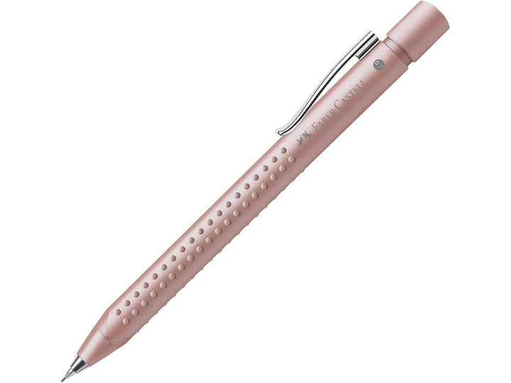 Faber-Castell Grip 2011 Mechanical Pencil 0.7mm in Pale Rose featuring an ergonomic triangular barrel, patented soft-grip dots, spring-loaded lead mechanism and integrated clip for comfortable everyday writing, drawing and note-taking.
