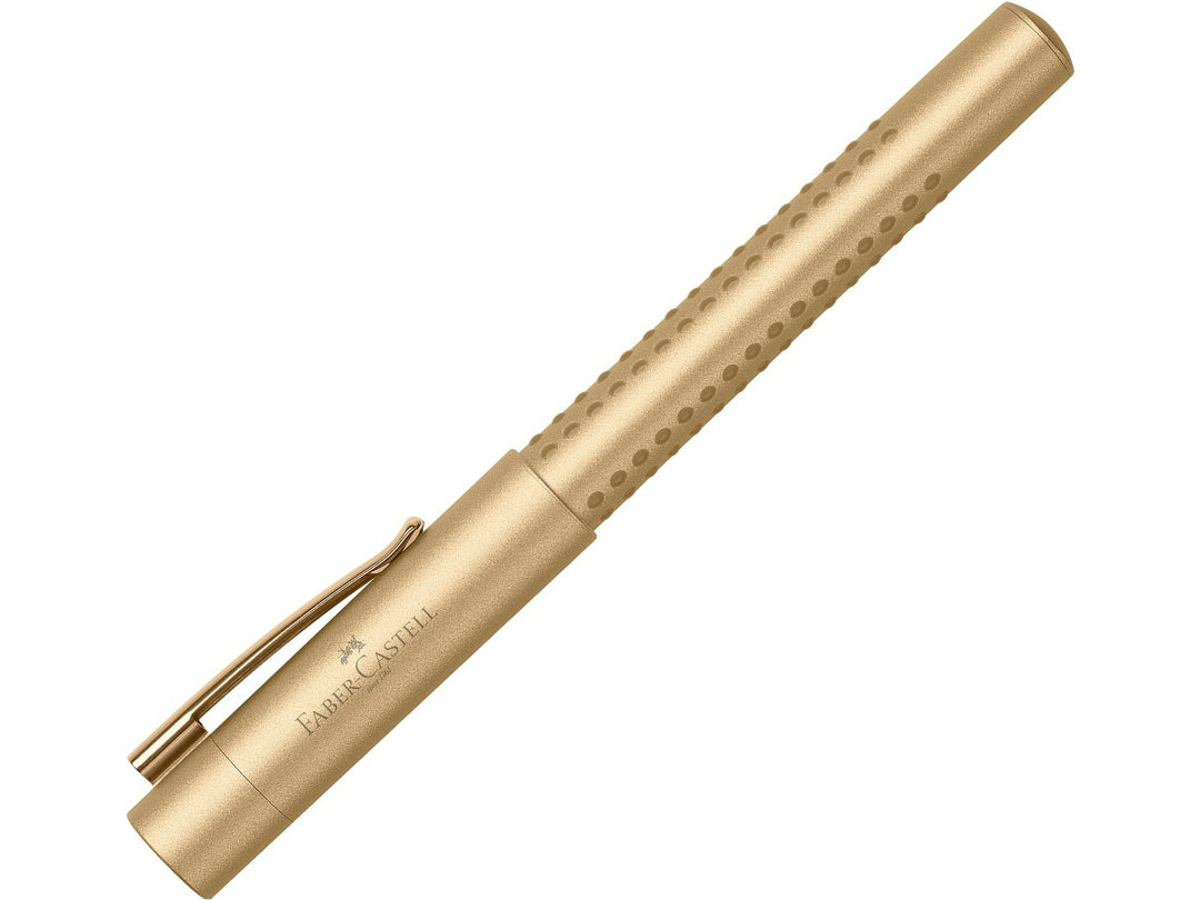 Faber-Castell Grip Edition Fountain Pen in Gold with cap fitted, featuring a metallic gold barrel with ergonomic Grip dots, durable metal pocket clip and lightweight design for precise everyday handwriting, journaling, note-taking and professional writing.