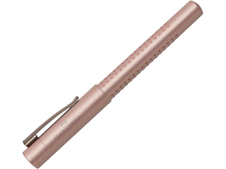 Faber-Castell Grip Edition Fountain Pen in Rose Copper with cap fitted, featuring a metallic rose copper barrel with ergonomic Grip dots, durable metal pocket clip and lightweight design for everyday handwriting, journaling, note-taking and professional writing.
