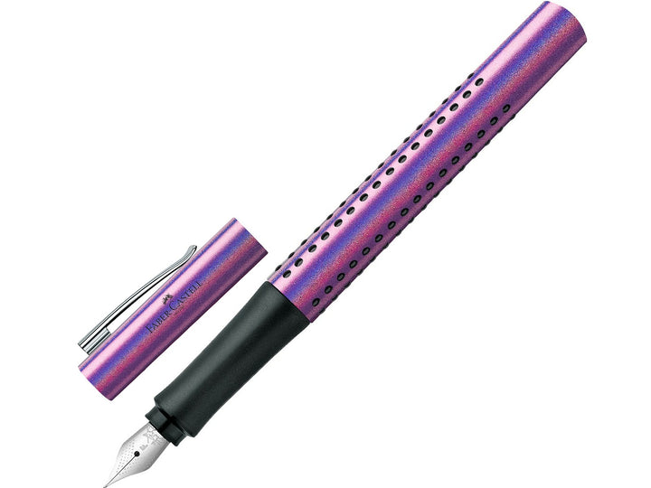 Faber-Castell Grip Edition Glam Fountain Pen in Violet with cap removed, featuring a shimmering metallic violet barrel with ergonomic Grip dots, durable stainless steel fine nib, metal pocket clip and lightweight design for everyday handwriting, journaling, note-taking and professional writing.