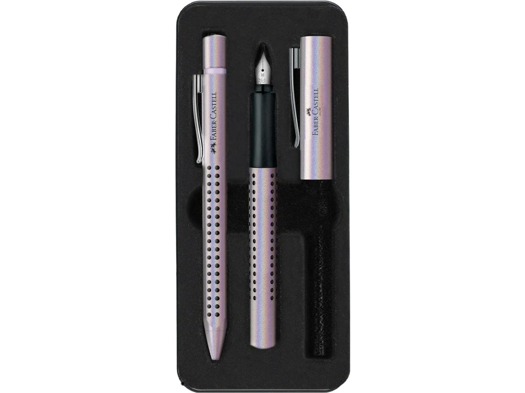 Close-up of the Faber-Castell Grip Edition Glam Writing Set Pearl displayed inside its presentation tray, featuring a matching pearl-effect fountain pen with stainless steel nib and coordinating ballpoint pen, both with ergonomic Grip dot barrels, metal clips and elegant everyday writing design.