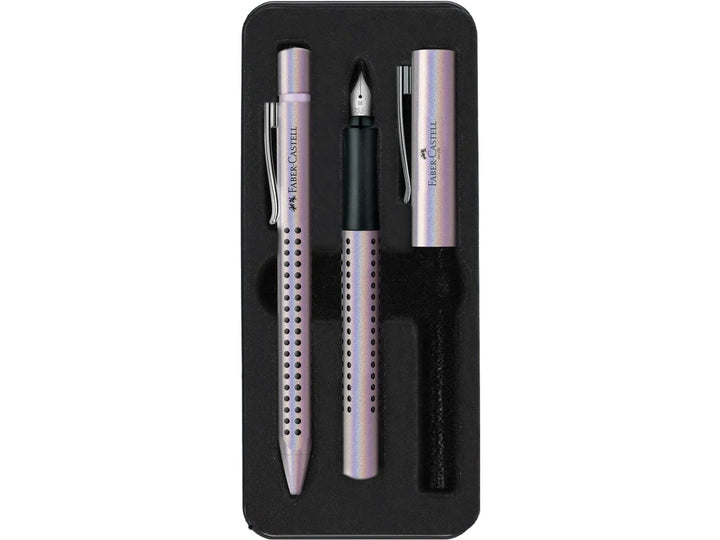 Close-up of the Faber-Castell Grip Edition Glam Writing Set Pearl displayed inside its presentation tray, featuring a matching pearl-effect fountain pen with stainless steel nib and coordinating ballpoint pen, both with ergonomic Grip dot barrels, metal clips and elegant everyday writing design.