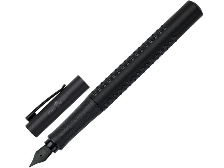 Faber-Castell Grip Edition Fountain Pen in Black with cap removed, featuring a matte black barrel with ergonomic Grip dots, durable stainless steel nib, textured grip section and metal pocket clip for everyday handwriting, journaling, note-taking and professional writing.
