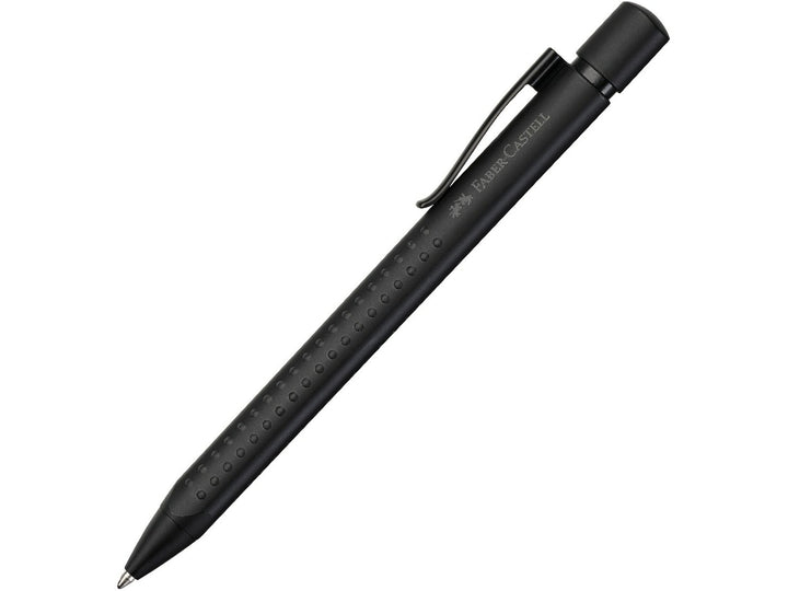 Faber-Castell Grip Edition Ballpoint Pen in Black featuring a matte black barrel with ergonomic Grip dots, retractable push-button mechanism, durable metal pocket clip and smooth everyday writing performance for note-taking, journaling and professional use.
