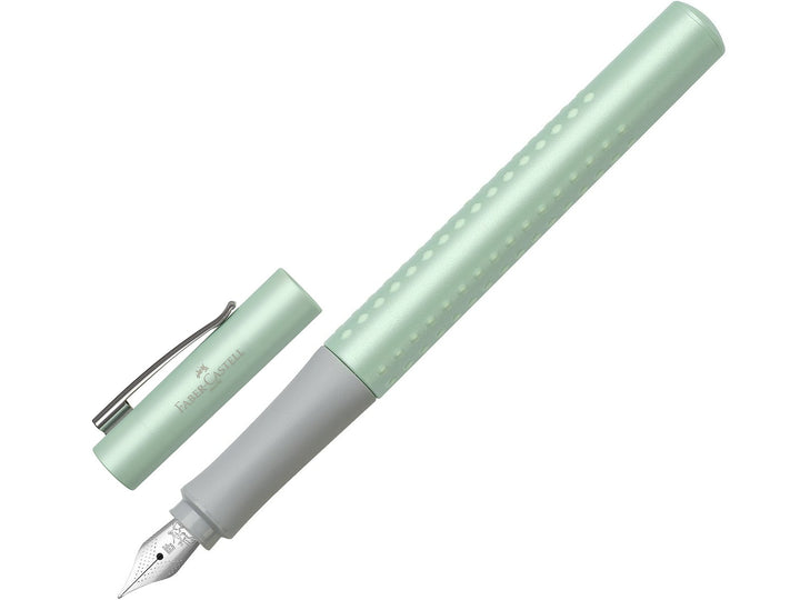 Faber-Castell Grip Pearl Edition Fountain Pen in Mint with cap removed, featuring a pearlescent mint barrel with ergonomic Grip dots, durable stainless steel nib, metal pocket clip and lightweight design for everyday handwriting, journaling, note-taking and professional writing.