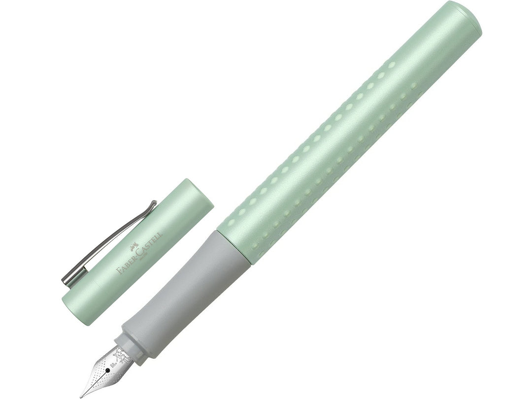 Faber-Castell Grip Pearl Edition Fountain Pen in Mint with cap removed, featuring a pearlescent mint barrel with ergonomic Grip dots, durable stainless steel nib, metal pocket clip and lightweight design for precise everyday handwriting, journaling, note-taking and professional writing.