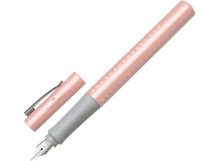 Faber-Castell Grip Pearl Edition Fountain Pen in Rose with cap removed, featuring a pearlescent rose barrel with ergonomic Grip dots, durable stainless steel nib, metal pocket clip and lightweight design for everyday handwriting, journaling, note-taking and professional writing.
