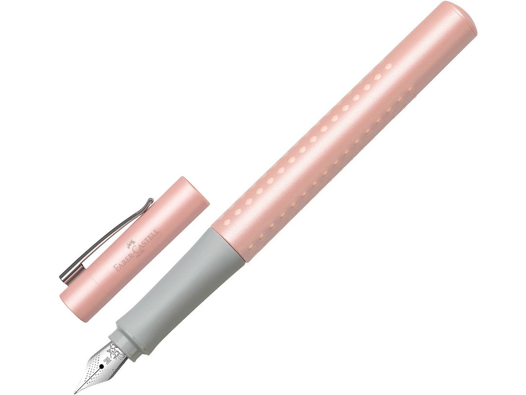 Faber-Castell Grip Pearl Edition Fountain Pen in Rose with cap removed, featuring a pearlescent rose barrel with ergonomic Grip dots, durable stainless steel nib, metal pocket clip and lightweight design for everyday handwriting, journaling, note-taking and professional writing.