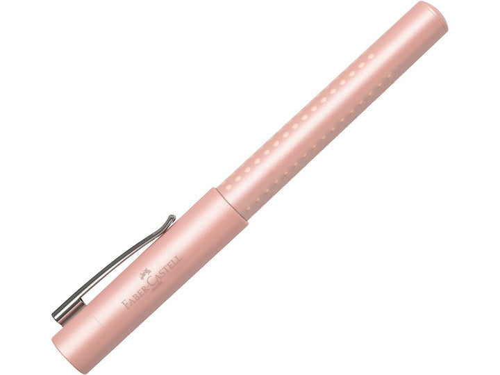 Faber-Castell Grip Pearl Edition Fountain Pen in Rose with cap fitted, featuring a pearlescent rose barrel with ergonomic Grip dots, durable metal pocket clip and lightweight design for everyday handwriting, journaling, note-taking and professional writing.
