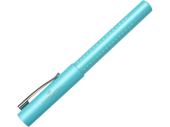 Faber-Castell Grip Pearl Edition Fountain Pen in Turquoise with cap fitted, featuring a pearlescent turquoise barrel with ergonomic Grip dots, durable metal pocket clip and lightweight design for everyday handwriting, journaling, note-taking and professional writing.