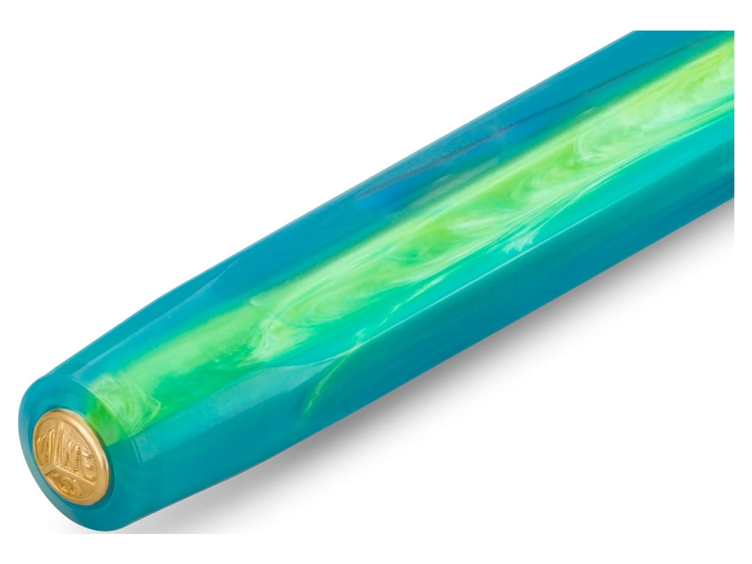 Detailed view of the Kaweco COLLECTION Marble Ocean fountain pen featuring an ocean-inspired blue and green marbled cap with gold-coloured Kaweco emblem