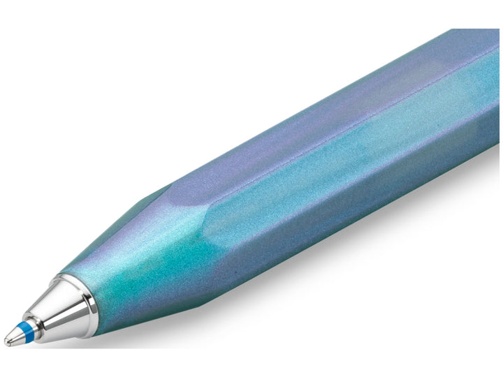 Close-up detail of the Kaweco LUNAR SPORT Ballpoint Pen in Shadow Blue, showcasing the shimmering blue and violet finish, iconic octagonal Sport barrel, chrome nose cone and extended blue ballpoint refill tip