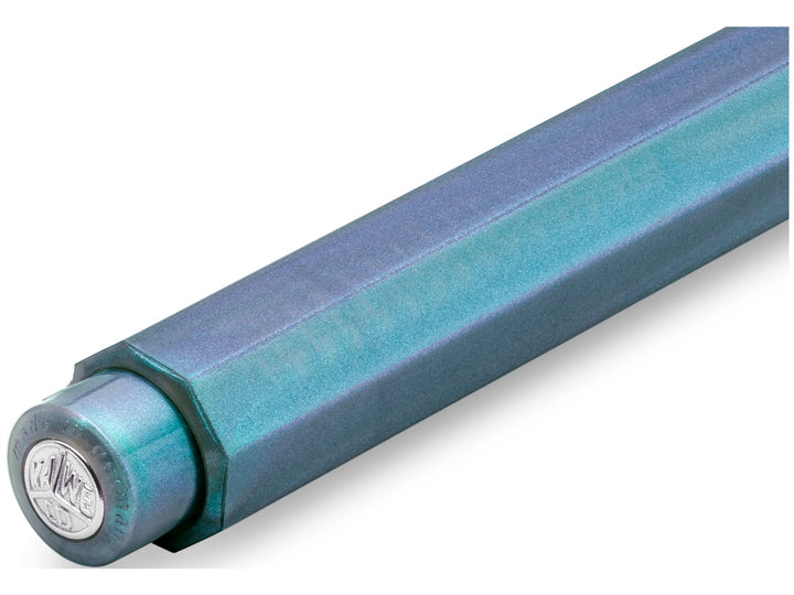 Close-up of the Kaweco LUNAR SPORT Clutch Pencil in Shadow Blue, showcasing the translucent octagonal barrel with shimmering turquoise and violet accents, visible internal mechanism and silver Kaweco coin finial integrated into the push-button end cap