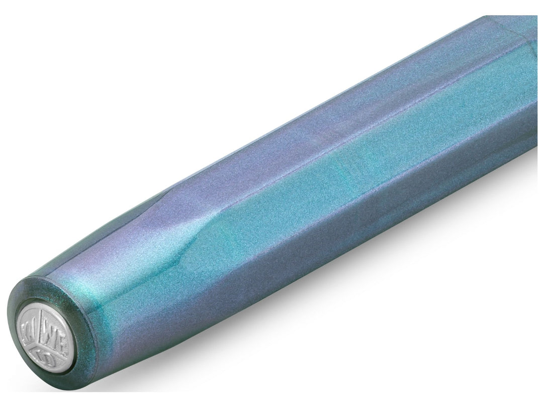Close-up of the Kaweco LUNAR SPORT Fountain Pen in Shadow Blue, showcasing the translucent octagonal cap with shimmering turquoise and violet accents, subtle pearlescent finish and silver Kaweco coin finial set into the end of the cap