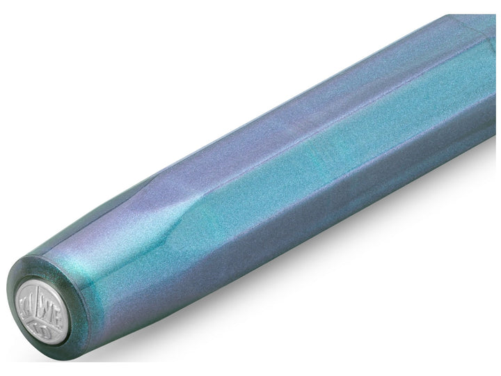 Close-up of the Kaweco LUNAR SPORT Fountain Pen in Shadow Blue, showcasing the translucent octagonal cap with shimmering turquoise and violet accents, subtle pearlescent finish and silver Kaweco coin finial set into the end of the cap