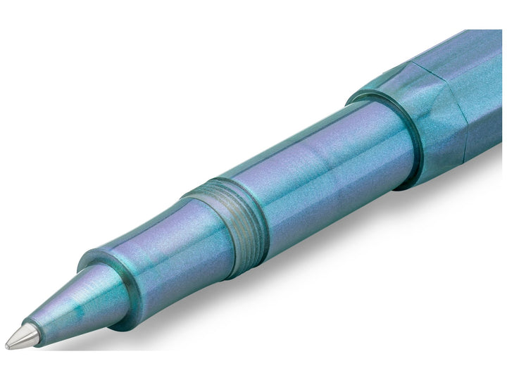 Close-up detail of the Kaweco LUNAR SPORT Rollerball Pen in Shadow Blue, showcasing the translucent grip section with shimmering turquoise and violet accents, threaded barrel connection, visible internal refill components and chrome rollerball tip fitted with a black Kaweco G2 refill