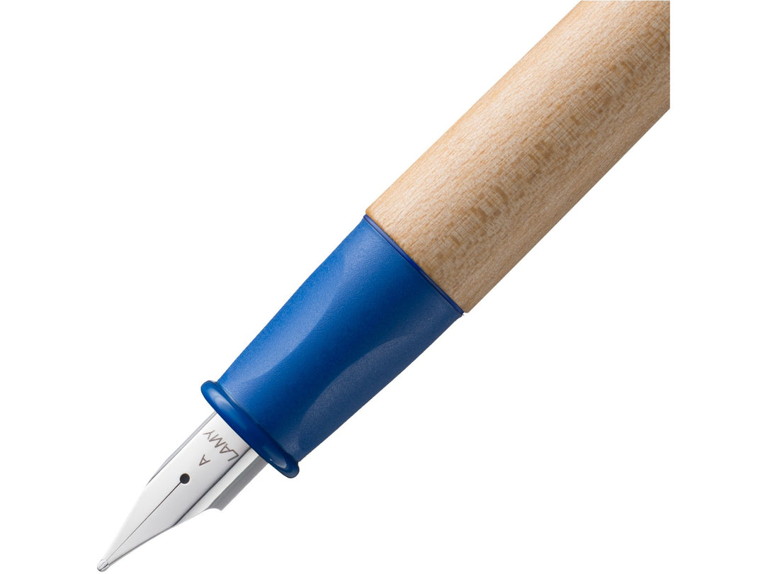 LAMY abc fountain pen close-up showing blue ergonomic non-slip grip section, maple wood barrel and beginner-friendly stainless steel A nib