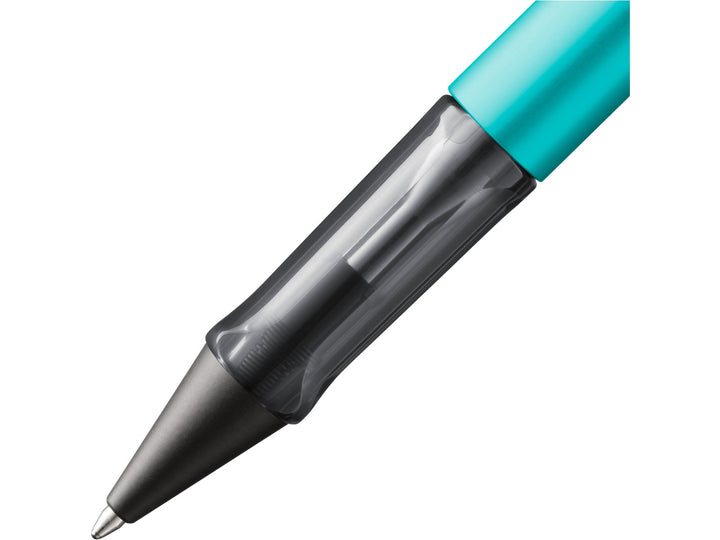 Close-up of the LAMY AL-star ballpoint pen in Turmaline, showing the transparent ergonomic grip section, anodised aluminium barrel and retractable ballpoint tip