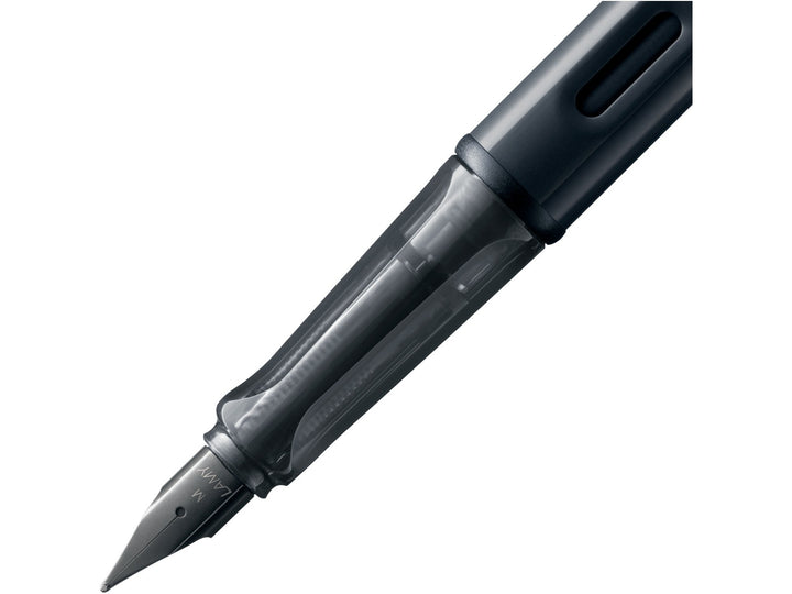 LAMY AL-star black fountain pen close-up of stainless steel nib, transparent grip section and ink window