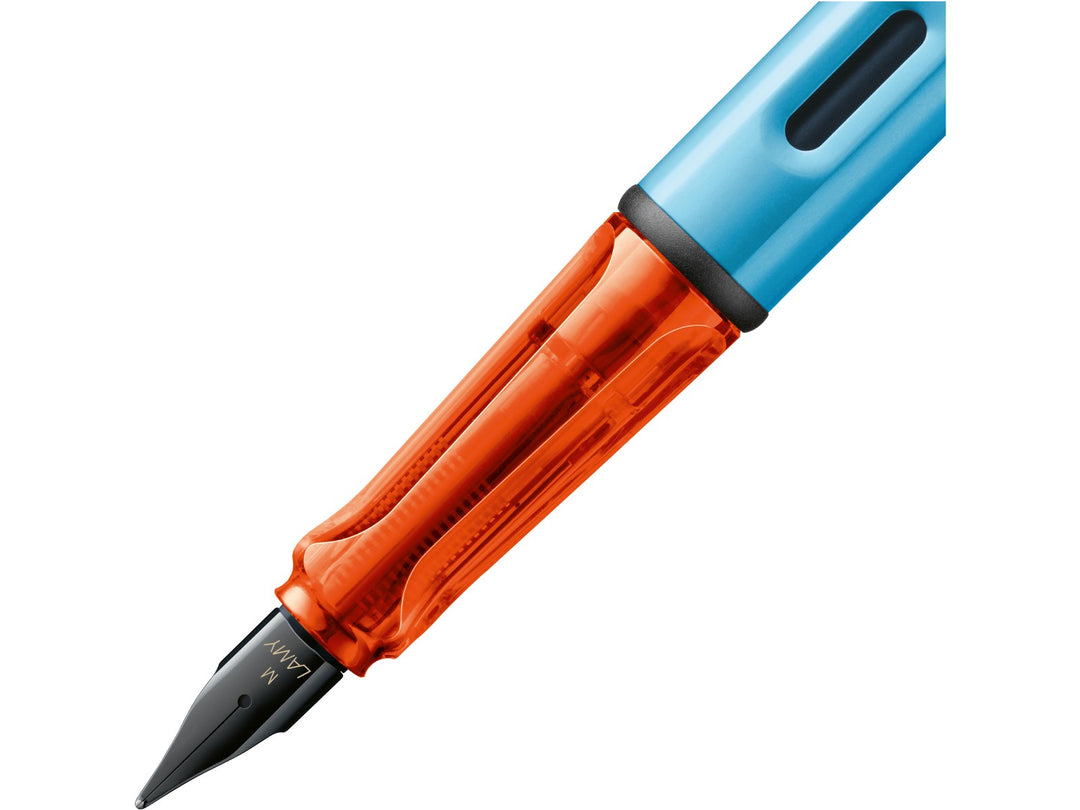 LAMY AL-star denim fountain pen close-up of stainless steel nib, transparent grip section and ink window