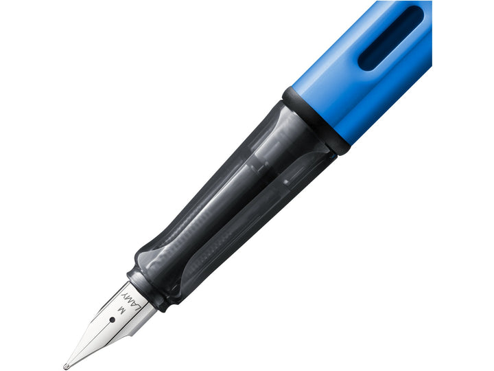 LAMY AL-star ocean blue fountain pen close-up of stainless steel nib, transparent grip section and ink window