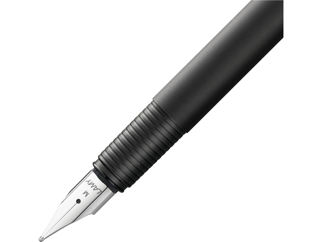 LAMY cp1 fountain pen close-up showing a polished steel nib and ribbed grip section on a slim black cylindrical barrel