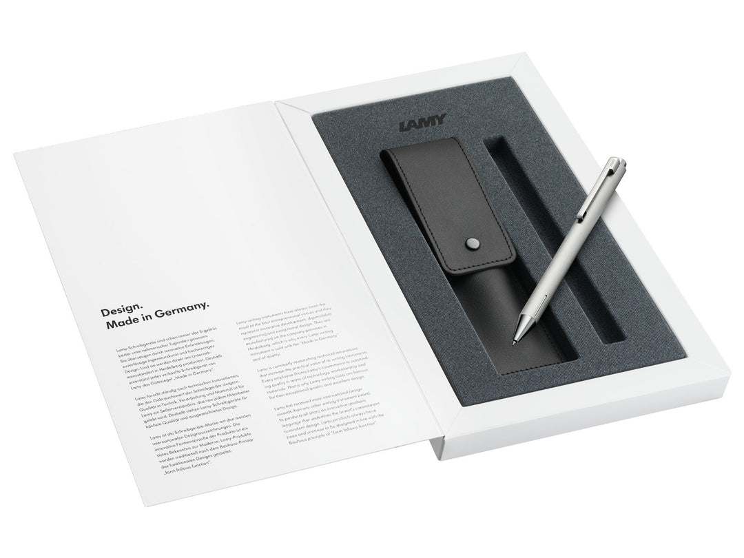 LAMY econ ballpoint pen set in brushed stainless steel with leather pen pouch presented in a LAMY gift box.