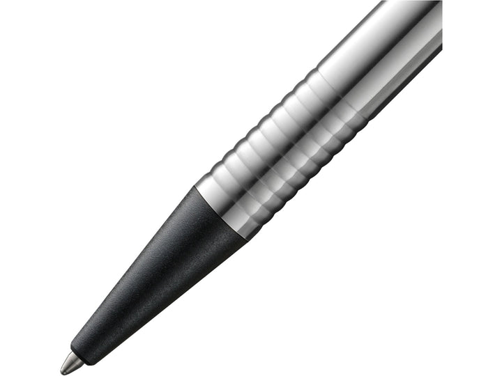 Close-up of the LAMY logo Ballpoint Pen in stainless steel with black trim, featuring the textured black grip section, satin-finished stainless steel barrel, precision metal tip and distinctive ribbed transition detail