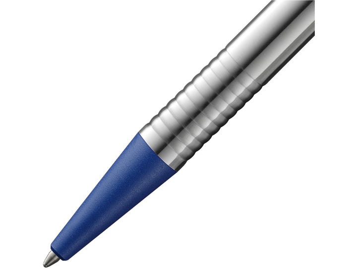 Close-up of the LAMY logo Ballpoint Pen in stainless steel with blue trim, featuring the textured blue grip section, satin-finished stainless steel barrel, precision metal tip and distinctive ribbed transition detail