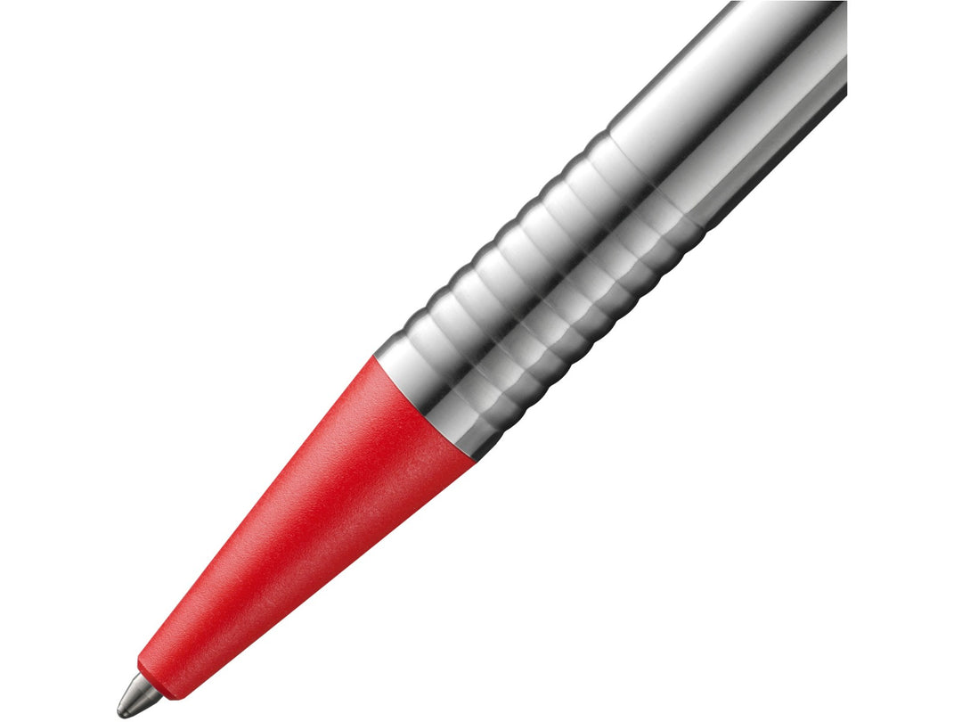 Close-up of the LAMY logo Ballpoint Pen in stainless steel with red trim, featuring the textured red grip section, satin-finished stainless steel barrel, precision metal tip and distinctive ribbed transition detail