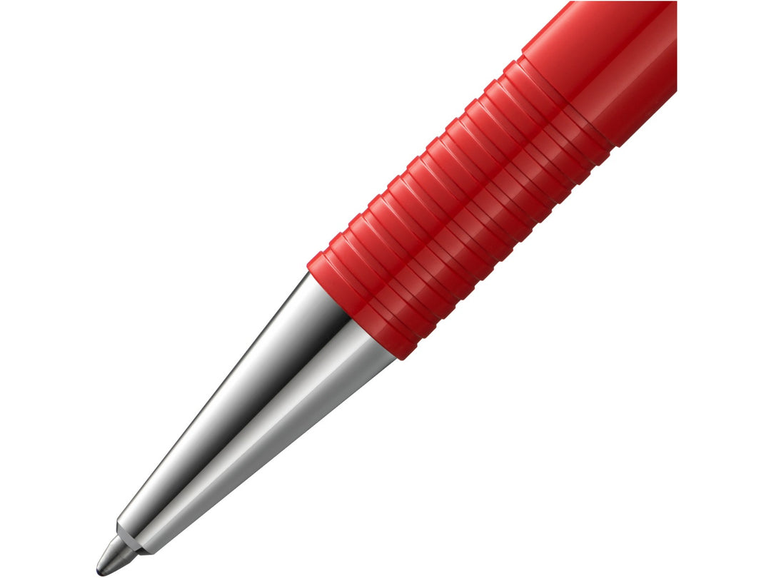 Close-up of the LAMY logo M+ Ballpoint Pen in Red featuring the polished metal cone tip, distinctive ribbed grip section, vibrant red barrel and durable lightweight construction
