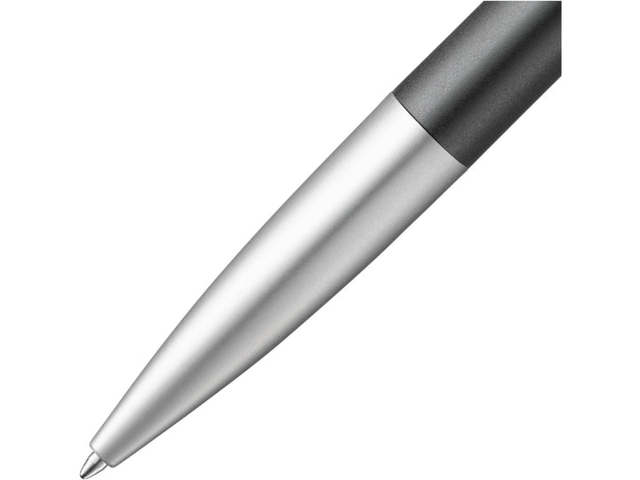 Close-up of the LAMY noto Ballpoint Pen in Black-Silver featuring the streamlined silver lower barrel, tapered writing tip and minimalist award-winning design by Naoto Fukasawa