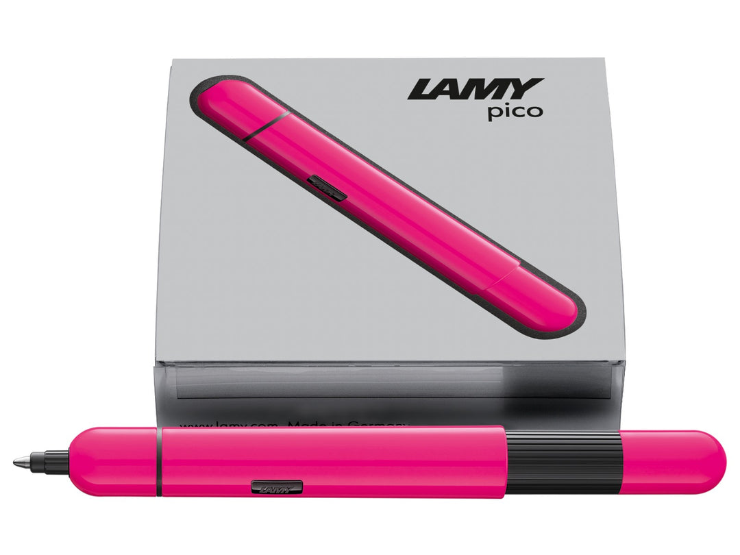LAMY pico ballpoint pen in neon pink displayed with LAMY presentation box, highlighting the compact pocket-sized design and innovative double push mechanism.