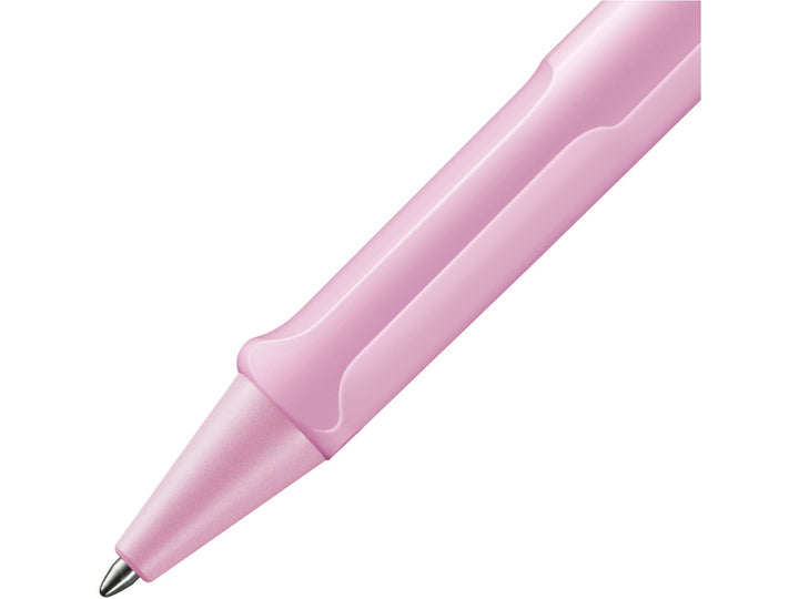 Close-up of the LAMY safari Ballpoint Pen in Light Rose featuring the ergonomic moulded grip section, matching Light Rose cone tip and durable ASA plastic construction