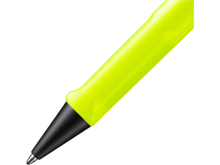 Close-up of the LAMY safari Ballpoint Pen in Neon Yellow 2026 Special Edition showing the ergonomic grip section, black cone tip and durable ASA plastic construction