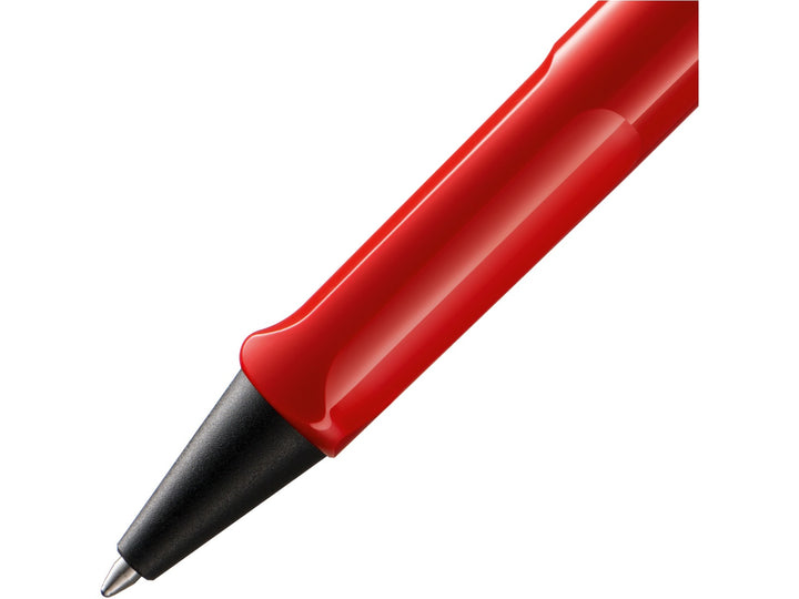 Close-up of the LAMY safari Ballpoint Pen in Red featuring the ergonomic moulded grip section, black cone tip and durable ASA plastic construction