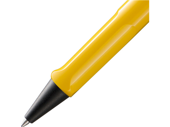 Close-up of the LAMY safari Ballpoint Pen in Yellow featuring the ergonomic moulded grip section, black cone tip and durable ASA plastic barrel