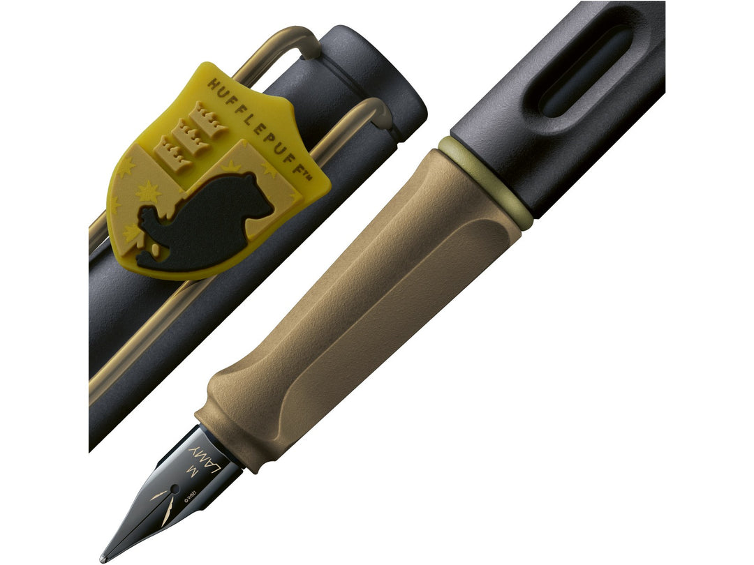 LAMY safari Harry Potter Hufflepuff fountain pen detail showing Hufflepuff crest charm, ergonomic grip section and black steel nib