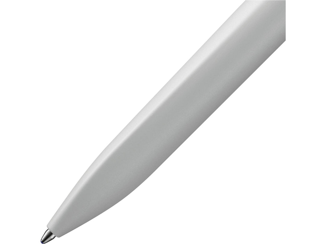 Close-up of the LAMY xevo ballpoint pen in light grey, highlighting the seamless transition from the ergonomic triangular grip section to the rounded barrel and the precision ballpoint writing tip