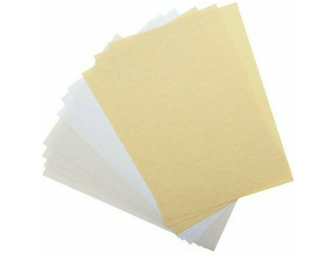 Manuscript parchment paper sheets showing aged texture and natural colour variation stacked in fan arrangement