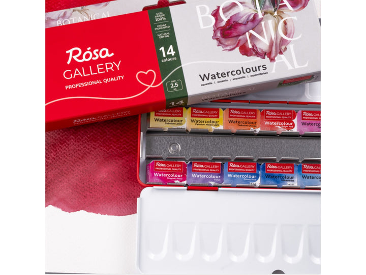 ROSA Gallery Botanical Watercolour Set showing the updated Botanical Collection packaging alongside 14 professional watercolour half pans in a metal case, featuring an integrated mixing palette and a carefully curated colour selection developed for botanical illustration and floral painting