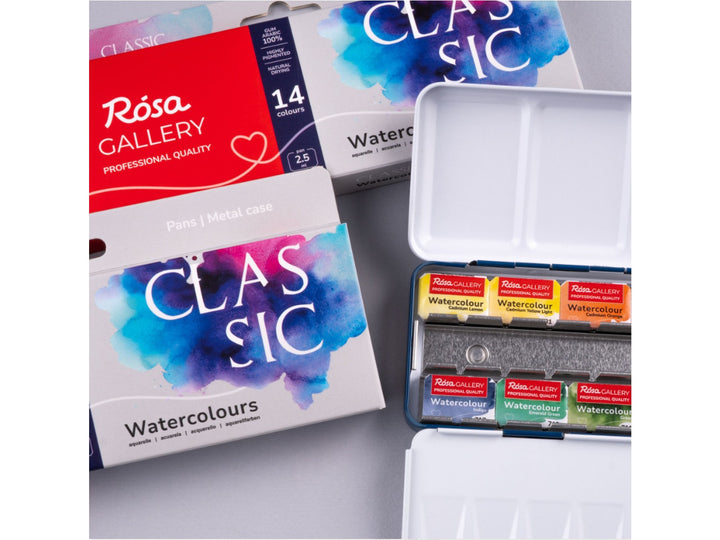 Lifestyle image of the ROSA Gallery Classic Watercolour Set featuring updated Classic Collection packaging, a metal watercolour case with professional watercolour pans, integrated mixing palette and curated artist colours for painting, sketching and illustration