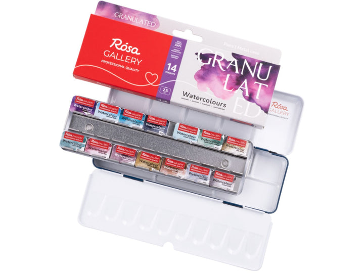 ROSA Gallery Granulated Watercolour Set showing 14 professional granulated watercolour half pans arranged in a metal travel case, accompanied by updated Granulated Collection packaging and an integrated mixing palette, designed to create unique texture effects, pigment separation and expressive watercolour washes