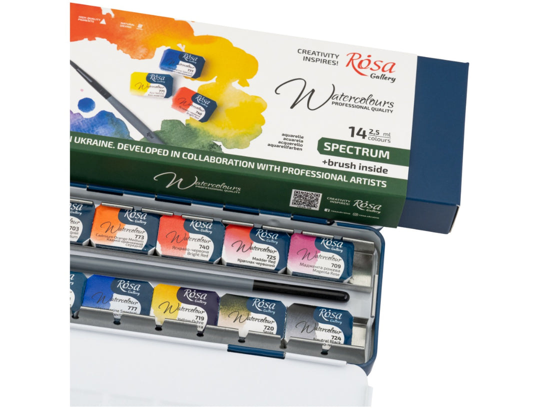 Close-up of the ROSA Gallery Spectrum Watercolour Set featuring updated Spectrum Collection packaging positioned above an open metal watercolour case, showcasing professional watercolour half pans, integrated mixing palette surfaces and the included travel brush designed for painting, sketching and versatile colour mixing